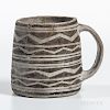 Mesa Verde Black-on-white Mug, c. 1100-1200 AD, the handle and sides with black-on-white geometric designs, ht. 3 3/4 in.Provenance: Pr