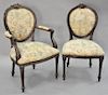 Set of twelve Louis XVI style dining chairs with two armchairs, all having tapestry style upholstery.