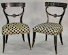 Pair of contemporary black and gilt side chairs in a checkered black and gold upholstery, seat height 17.5 inches.