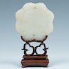 JADE CARVED LOTUS FORM PENDANT AND STAND, 19/20 C.