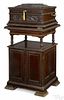 Criterion mahogany disc music box and stand, late 19th c., elaborately carved