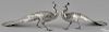 Pair of Continental silver peacocks, late 19th c., with articulated wings, 9'' h., 19 1/2'' l.