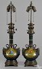 Pair of Continental ormolu and painted metal table lamps, 19th c., each with an oval reserve