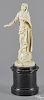 Continental carved ivory figure of a woman, 19th c., standing atop a sphere with a serpent