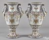 Pair of Continental faience urns, early 20th c., with swan-form handles, 27'' h.