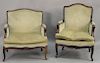 Two near matching Louis XV style armchairs.