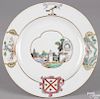 Chinese export porcelain armorial plate, 18th c., with a central vignette with European buildings