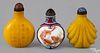 Three Chinese glass and porcelain snuff bottles, 2 3/4'' h., 2 3/4'' h., and 2 1/2'' h.