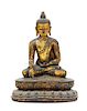 * A Sino-Tibetan Gilt Bronze Figure of Buddha Shakyamuni Height 7 1/4 inches.