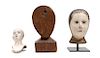 * A Neapolitan Gessoed Wood Head of a Saint Height of largest 12 1/2 inches.