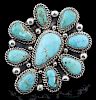 A TURQUOISE CLUSTER RING SIGNED AUGUSTINE LARGO