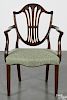 George III mahogany shieldback dining chair, ca. 1790, with carved sheaf of wheat and bellflower