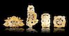 * A Group of Four Pierce Carved Jade Pendants Height of tallest 5 1/4 inches.