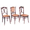 Lote de sillas. Austria, prin. siglo XX. En madera tallada de roble. Respaldos abiertos, con asientos de bejuco tejido. Piezas: 3