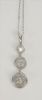 Platinum pendant, set with three diamonds in circles, .48 cts., .45 cts., and .37 cts.
pendant: height 1 3/8 inch