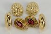 Three pairs of 18 karat gold earrings to include two pierced and one ear clip, one pair set with red stones, and one with small diam...