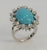 Transformable ring, pendant, brooch, having a cabochon oval turquoise surrounded by twenty-four diamonds, mounted in 14 karat white ...
