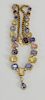 14 karat gold sapphire and diamond necklace, twenty-four various colored emerald cut sapphires with twenty-two small round diamonds,...