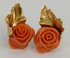 18 karat gold ear clips, set with carved coral roses. 
14.6 grams total weight