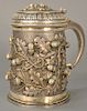 Continental silver covered tankard, the whole with embossed oak leaves and acorns. 
height 7 3/4 inches, 31.7 troy ounces