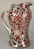 Cranberry silver overlay pitcher. 
height 8 1/2 inches