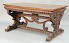Renaissance style walnut writing desk with rectangular top on carved frieze,  fitted glass top and pierced carved sides with drawer ...