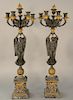 Pair of bronze and gilt bronze candelabra, seven light with bronze caryatids on spheres, on square bronze and marble bases. 
height ...