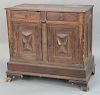 Italian walnut cabinet with two drawers over two doors, 
on plain base with ogee feet, raised panel back and sides, probably Italian...