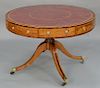 George III mahogany and rosewood drum table, having four drawers, inset leather revolving top on pedestal with four down swept membe...