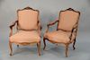Pair of Continental carved rosewood open armchairs,  late 19th/early 20th century with custom upholstery, arms partially upholstered