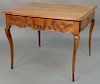 Louis XV fruitwood center table with drawer on either end with floral carved sides, set on delicate cabriole legs, 18th century. 
he...