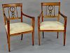 Pair of Continental fruitwood armchairs  each with two snakes and arrow back, early 19th century (legs ended)