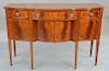 Fineberg Federal style mahogany sideboard with shaped top, 
over conforming case of three drawers over four doors, all set on square...