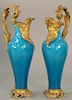 Pair of blue glazed porcelain urns having bronze mounted spout of bearded man, bronze handle ending on bronze foot.
height 13 3/4 in...