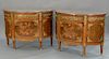 Pair of Louis XVI style demilune commodes with marble tops,  over cabinet of three center drawers, inlaid and gilt bronze mounted fl...