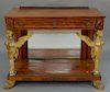 Mahogany pier table with drawer and bronze mounts, 
supported by carved and gilt caryatids, having mirrored back, set on base with g...