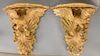 Pair of carved giltwood and gesso eagle bracket shelves, 
each with spreading eagle rocaille and acanthus carving, 19th century (rep...
