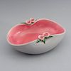 Dulcero. Francia, años 50. Elaborado en cerámica rosa y gris Sevrés, acabado brillante. Decorado con motivos florales y vegetales.
