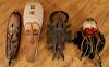 COLLECTION OF FOUR CARVED WOOD AFRICAN MASKS