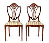 A Pair of Polychrome Floral Painted Satinwood Chairs Height 36 x width 18 x depth 15 1/2 inches.