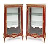 A Pair of Louis XV Style Vitrine Cabinets Height 59 3/4 x width 34 x depth 18 inches.