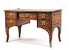 A Louis XV Style Marquetry and Gilt Bronze Mounted Bureau Plat Height 31 1/2 x width 51 x depth 28 inches.