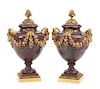 A Pair of French Gilt Bronze Mounted Porphyry Urns Height 23 inches.
