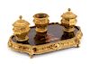 A French Gilt Bronze and Lacquered Inkwell Width 13 3/4 inches.