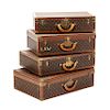 Four Louis Vuitton Suitcases Height of largest 20 x width 29 3/4 x depth 8 1/2 inches.