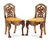 A Pair of Continental Carved Side Chairs Height 36 1/2 inches.