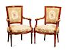 A Pair of Neoclassical Walnut Armchairs Height 34 inches.