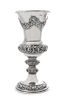 * An Austrian Silver Chalice, J. Reiner, Vienna, 1847, the tapering cup worked to show repousee floral swags, raised on a simila