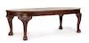 A George III Carved Mahogany Dining Table Height 29 x width 44 inches (closed).