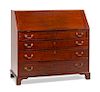 A George III Mahogany Slant-Front Desk Height 43 1/2 x width 47 1/2 x depth 22 inches.